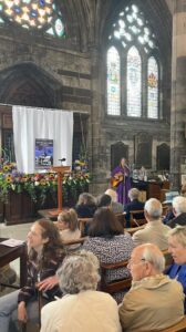 Connie MacLeod - Author of William Ridley and the Celtic Cross singing at Glasgow Cathedral for Glasgow's 850th celebration and unveiling of new stained glass windows, designed by Talia Blatt