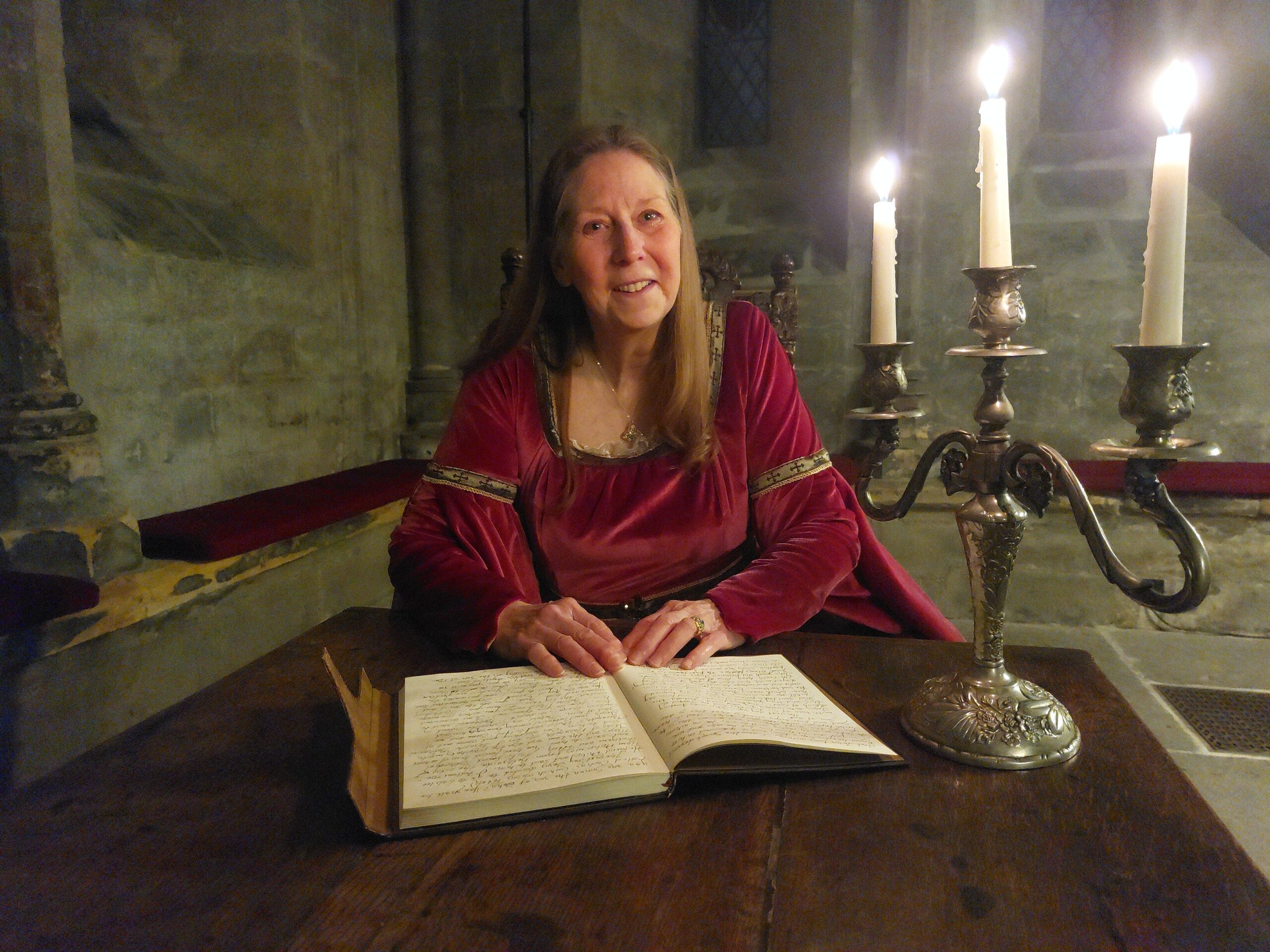 Connie MacLeod at Glasgow Cathedral Lower Chapter House reading the Book of John by candlelight - photo by Amos Ferrell Genesis Christian Radio